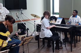 Thumnail of John with Students
